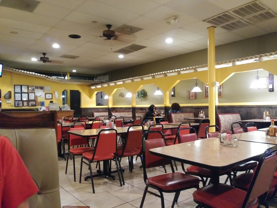 Casual dining room with tables and chairs.